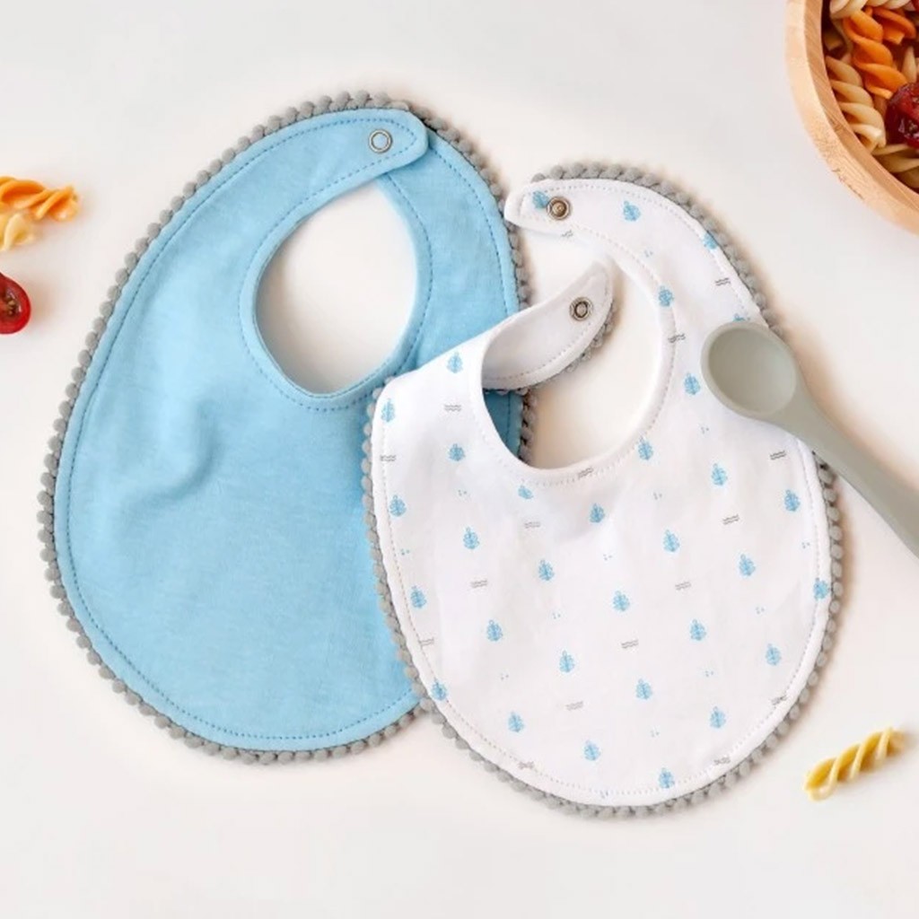 Babero bebe pack 2 unidades celeste con cucharita