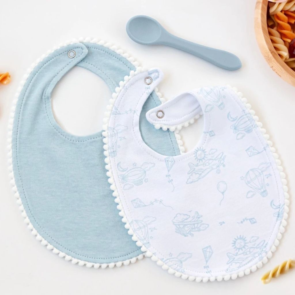 Babero bebe pack 2 unidades celeste con cucharita