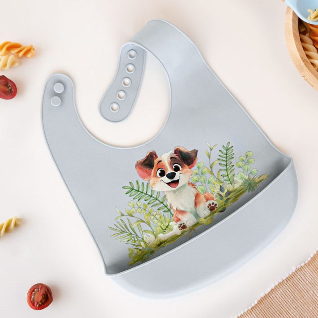 Babero silicona con recogemigas perrito celeste