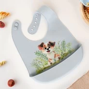 Babero silicona con recogemigas perrito celeste
